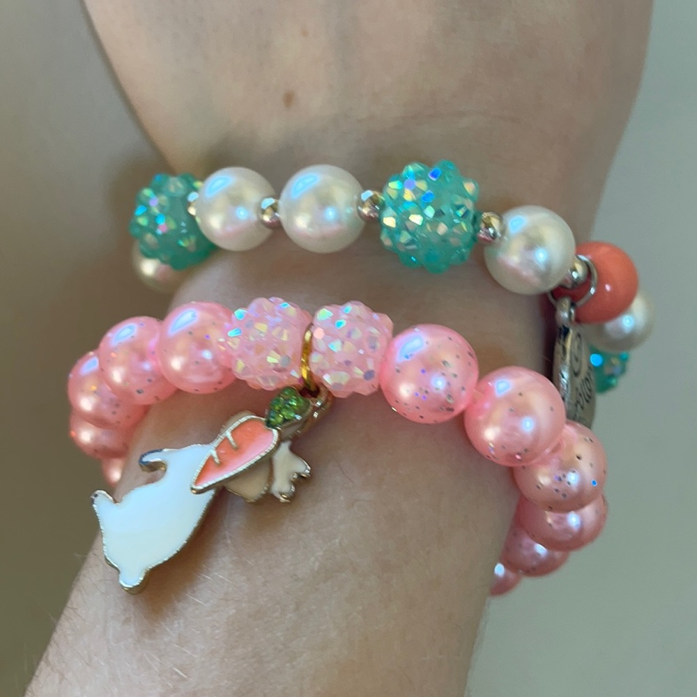2 small bracelets with charms